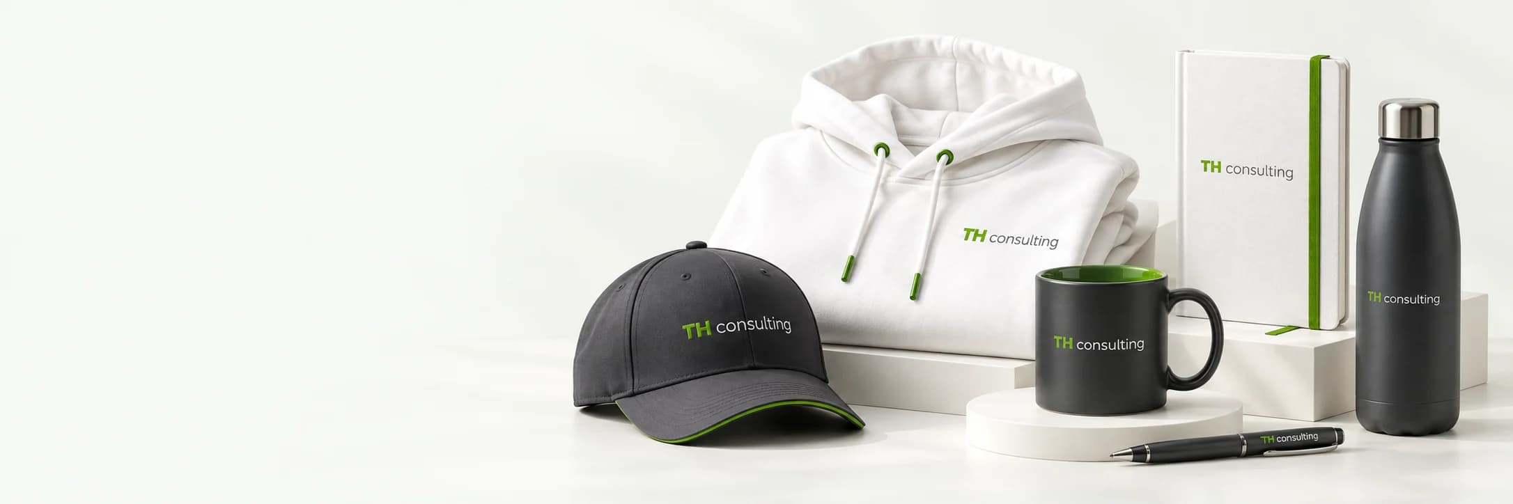 TH consulting merch: hoodie, baseball cap, mug, notebook, insulated bottle and pen